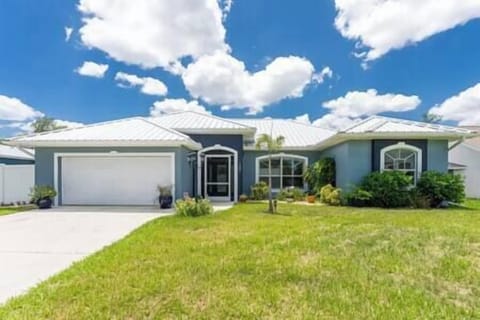 Welcome to this spacious home and lovely gardens under the Florida sun. 