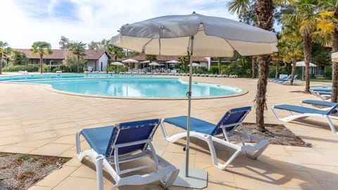 Dive into the outdoor pool on a hot summer day.