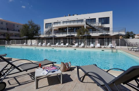 Relax by the stunning poolside oasis.