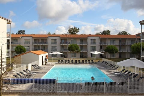 Lounge by the pool in the sunshine.