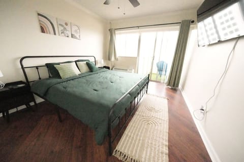 King bed w/ sound machine. USB ports on nightstands. 55” smart TV.