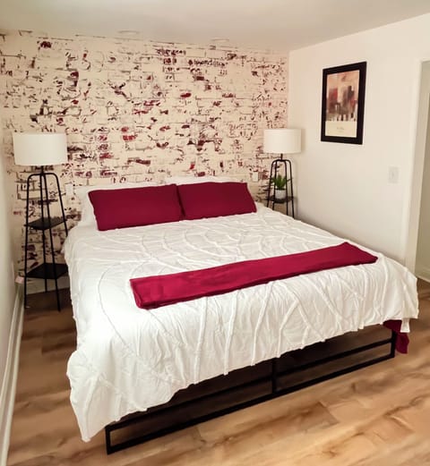 Bedroom with King bed, TV and desk - designated working space.