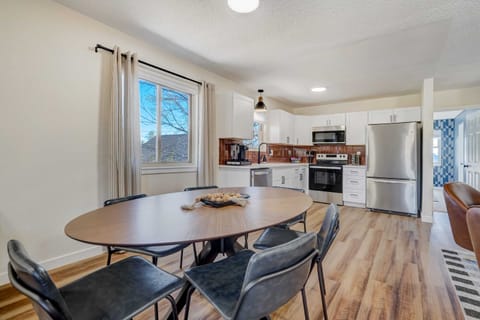 Gather around our spacious kitchen, complete with a 6-seater dining table, essential appliances like a fridge and oven, and a convenient coffee maker. From morning brews to family dinners, this is where delicious memories are made.