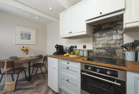 The Corner Cottage, Carnhell Green, Hayle: The half round table is perfect for romantic dining