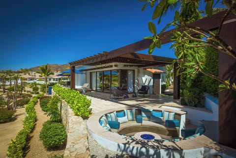 Mosaic-tiled hot tub beside the infinity pool with ocean views at Villa Esperanza in Palmilla Caleta, Los Cabos.