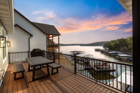 Spacious deck perfect for dining, watching sunsets, and enjoying stunning views.