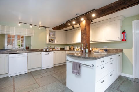 The kitchen with an island and plenty of space for meal preparation