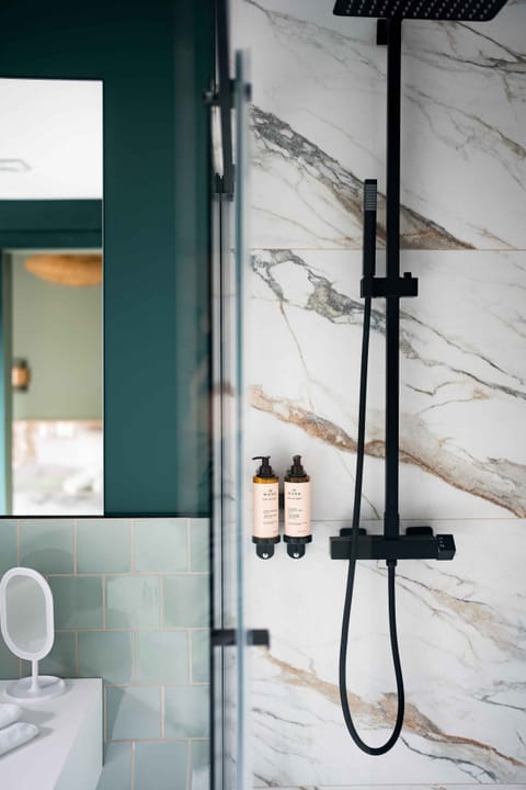 Shower, hair dryer, slippers, towels