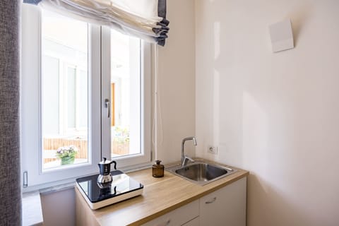 Triple Room, Balcony | Private kitchen