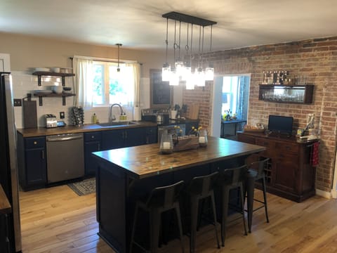 Fully stocked kitchen with large island.