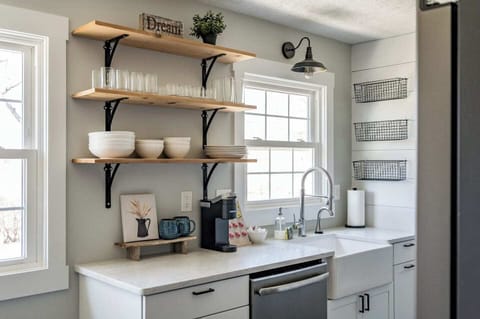 Kitchen with open shelves and large sink