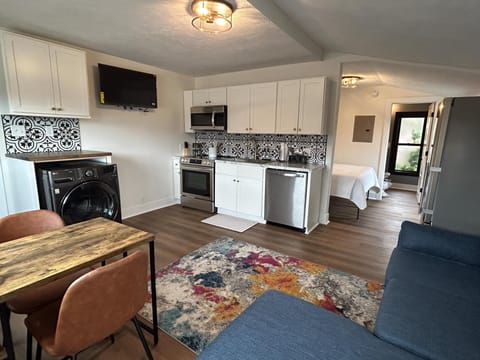 Queen 300 sq. ft. Studio at the Victorian Unit C living area and kitchen