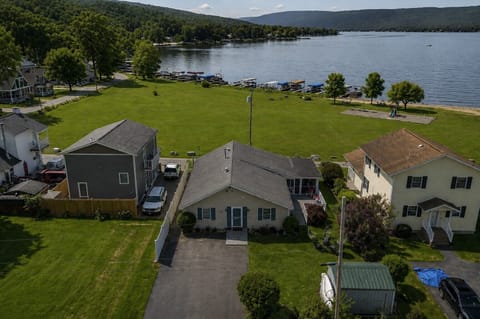 Charming lakeside retreat with ample green space and easy access to Honeoye Lake. Ideal for family gatherings and outdoor fun. 