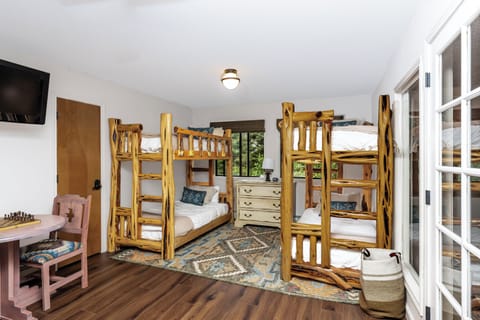 Two twin over twin bunk beds on the third floor. 