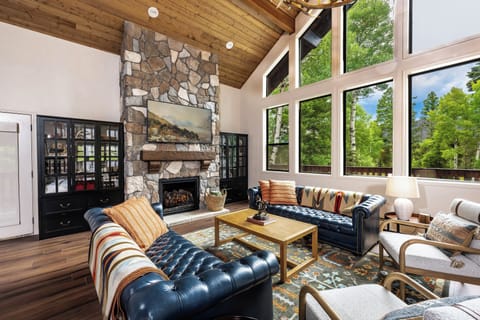 The frame TV is perfect for movie nights by the beautiful newly renovated stone fireplace. 