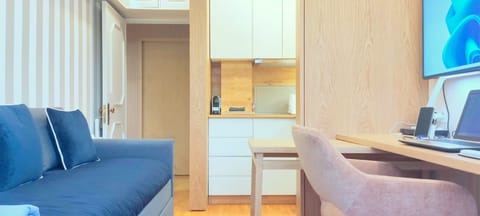 Living Room with Kitchen, Large Work Space and Couch