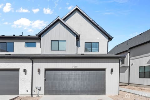 Featuring a 2-car garage with a charging station for your EV.