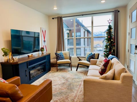The open living and kitchen area provides a perfect space for relaxation and entertaining.