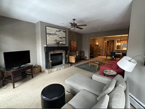 Relax in our comfortable living room, featuring cozy seating, a warm fireplace, and a flat-screen TV. Ideal for movie nights and family gatherings.