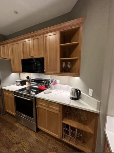 Utilize our compact kitchen, featuring modern amenities, ample storage, and a convenient layout. Perfect for preparing quick and easy meals.