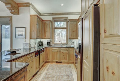 Prepare meals with ease in the well-equipped kitchen, boasting a large island, high-end appliances, and ample counter space for all your cooking needs.