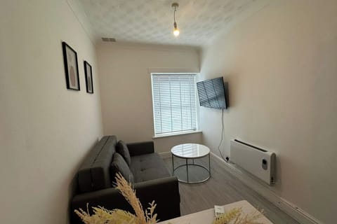 Whether you're watching TV, reading a book, or simply lounging, the living room offers a warm and homely vibe that makes it easy to settle in and feel at ease.