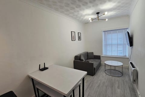 Whether you're watching TV, reading a book, or simply lounging, the living room offers a warm and homely vibe that makes it easy to settle in and feel at ease.