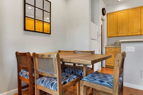 Dining Room: 5-person dining table, situated between living room and kitchen
