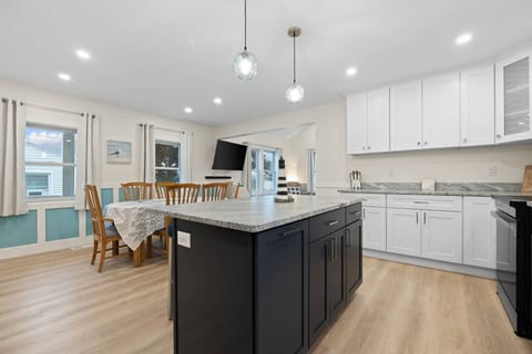 Large kitchen equipped with all cooking essentials and large dining room for family meals