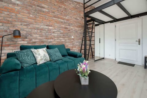 Living room with a comfortable sofa and TV. 