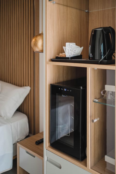 Junior Double or Twin Room, Sea View | Minibar, in-room safe, blackout drapes, soundproofing