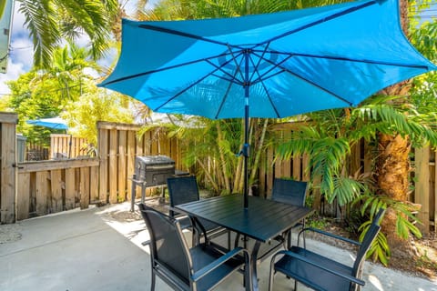 Step outside to a private patio with a BBQ grill and outdoor dining set for four.