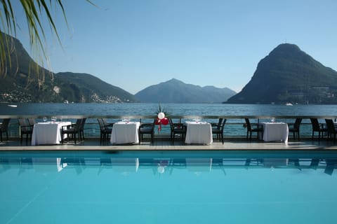 Seasonal outdoor pool, open 8:30 AM to 7:00 PM, pool umbrellas