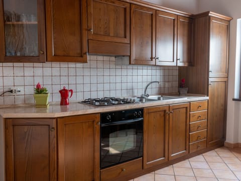 Fridge, toaster, cookware/dishes/utensils, dining tables