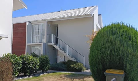 Your apartment is on the right up the stairs.