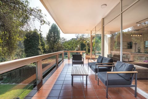 Second-floor terrace featuring a lounge sofa for relaxing moments.