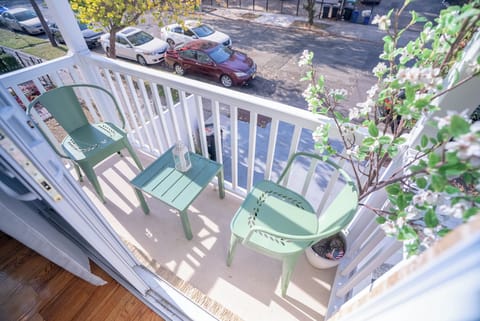 Small Balcony: Step outside to a quaint balcony space with seating, ideal for morning coffee or evening relaxation.
