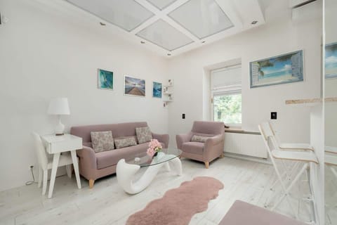 Living room with a comfortable sofa and TV. 