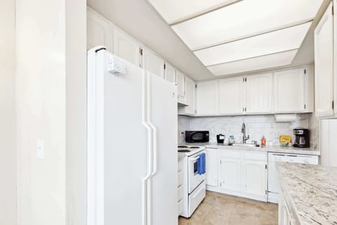 Functional kitchen providing essential appliances creating a clean and practical cooking space