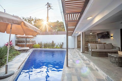 Outdoor pool, pool umbrellas, sun loungers