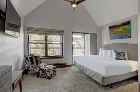 Spacious master bedroom with a comfortable king bed and plenty of natural light.