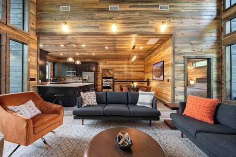 Living room opens to kitchen and dining areas