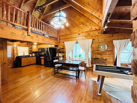 View from pool table to full kitchen