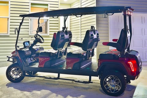 Six-seater golf cart available for your use.