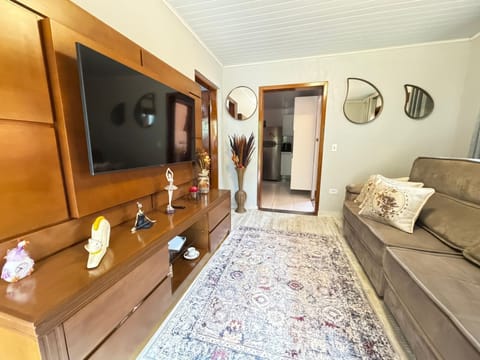 Premium House | Living area | 50-inch LCD TV with digital channels, Netflix, streaming services
