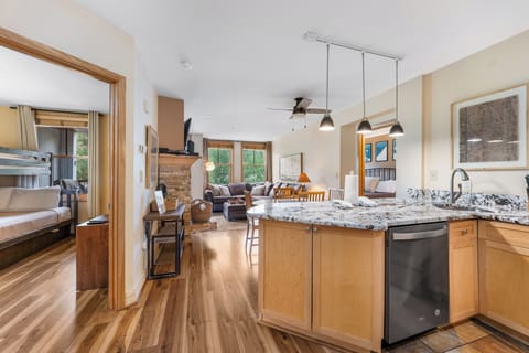 Your spacious open-concept kitchen flows seamlessly into the cozy living area, perfect for gathering with family and friends.