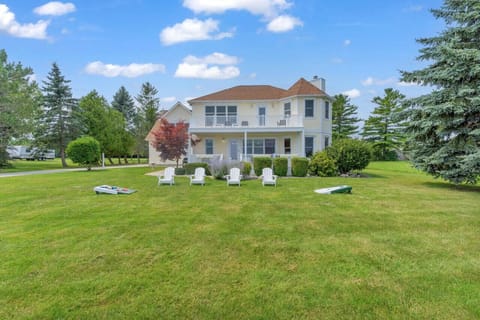 Cornhole and outdoor seating to work on your tan