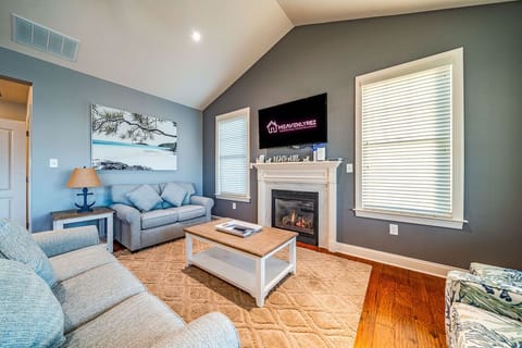 Open living room area with a gas fireplace
