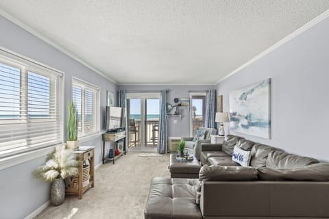 The ocean front living room is well-appointed with comfortable furnishings.