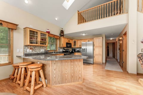 Our fully stocked kitchen has everything you need for cooking, plus a special coffee bar for gourmet coffee lovers. Enjoy plenty of counter space and one of two full-sized refrigerators in the home, making it easy to prepare meals and entertain your group.